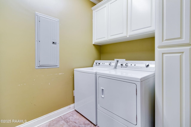 washroom featuring cabinets, independent washer and dryer, electric panel, and light tile patterned flooring