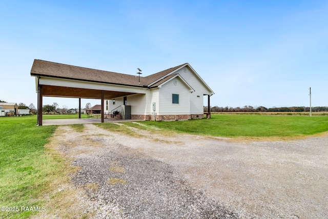 view of property exterior with a yard and a carport