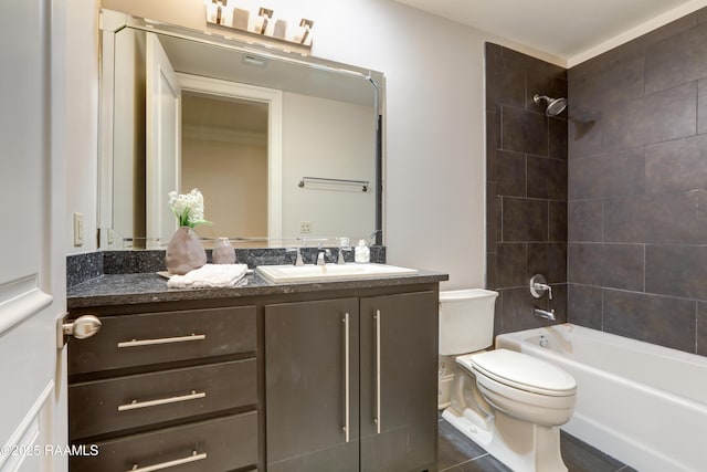 full bathroom featuring toilet, tile patterned flooring, vanity, and tiled shower / bath