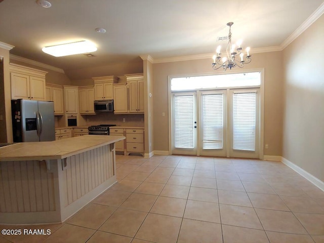 kitchen with light tile patterned floors, pendant lighting, stainless steel appliances, and a breakfast bar area