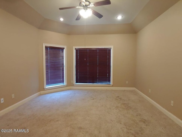 unfurnished room featuring ceiling fan and carpet