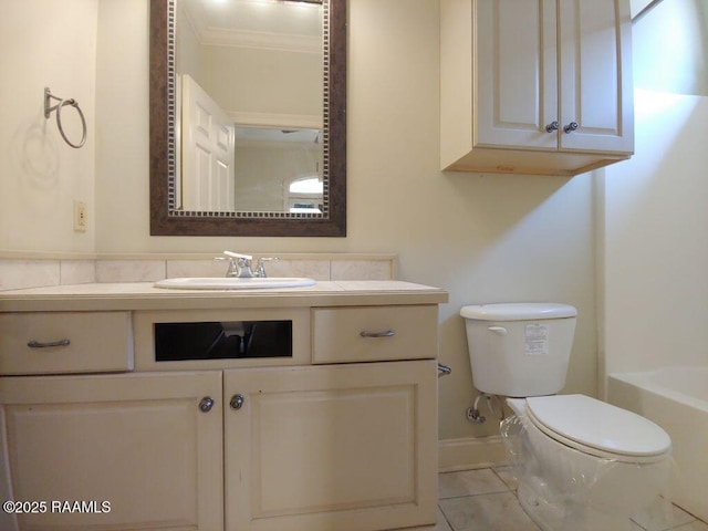 bathroom featuring a washtub, tile patterned floors, crown molding, toilet, and vanity