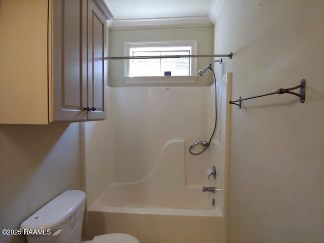 bathroom with shower / tub combination, toilet, and crown molding