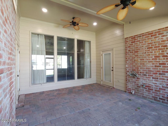 view of patio featuring ceiling fan