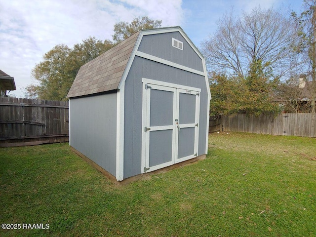 view of outdoor structure with a lawn