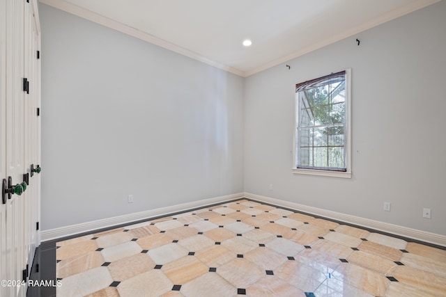 spare room with ornamental molding