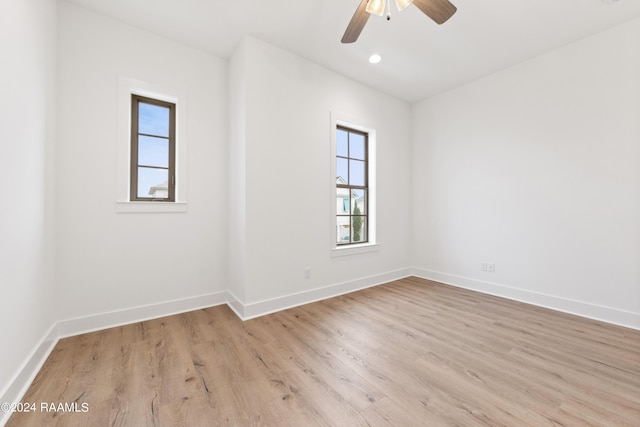 empty room featuring ceiling fan and light hardwood / wood-style floors