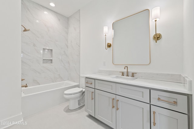 full bathroom with vanity, toilet, and tiled shower / bath