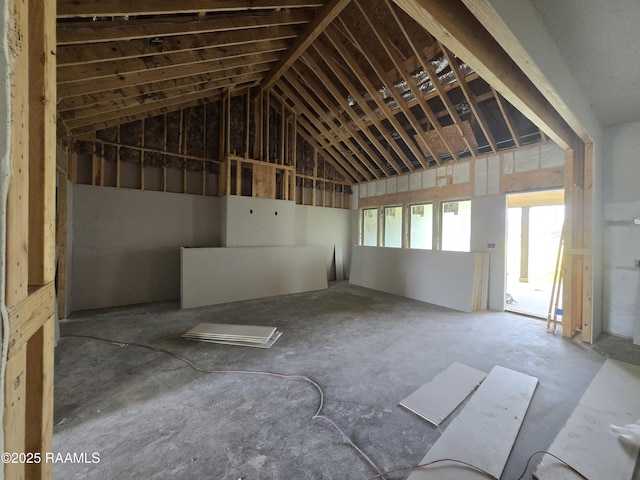 misc room with lofted ceiling