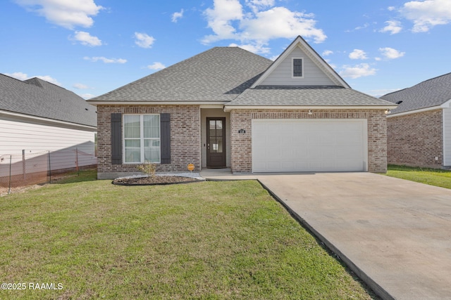 view of front of house featuring a front lawn and a garage