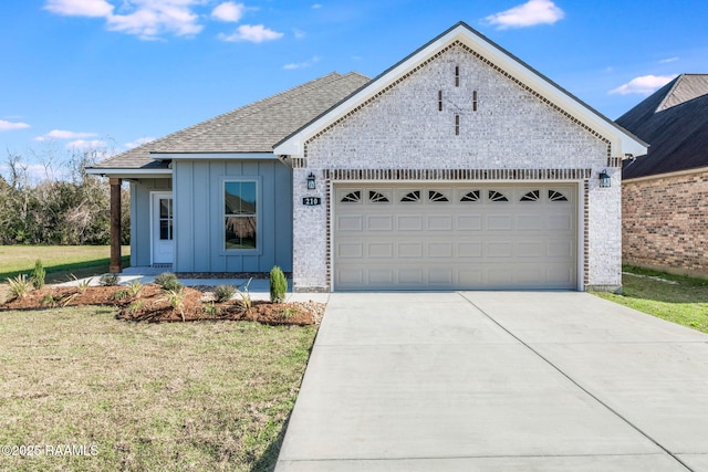 view of front of home featuring a garage and a front lawn