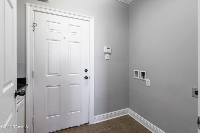 laundry room featuring hookup for an electric dryer, washer hookup, and dark tile patterned floors