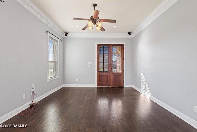 spare room featuring ceiling fan, french doors, dark hardwood / wood-style floors, and ornamental molding