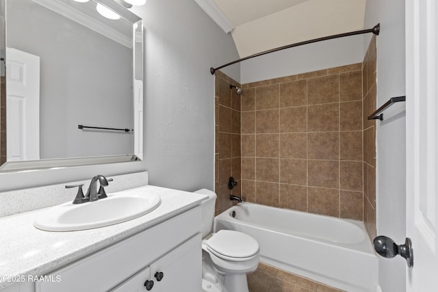 full bathroom with tiled shower / bath combo, toilet, ornamental molding, and vanity