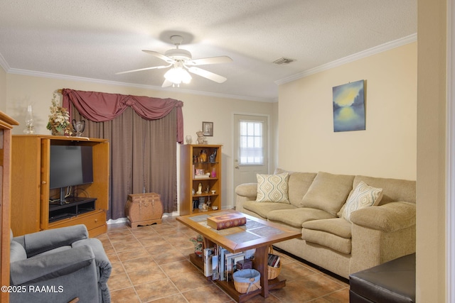 living room featuring a textured ceiling, ceiling fan, crown molding, and light tile patterned flooring