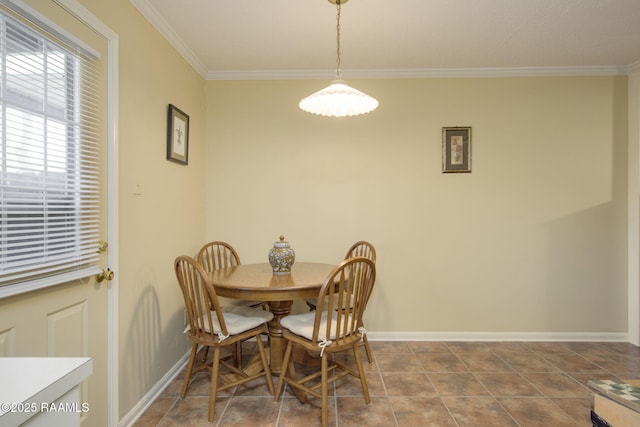 dining space with crown molding