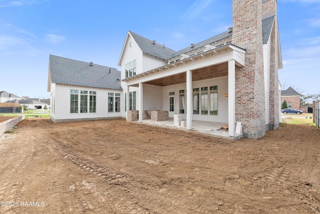 rear view of house featuring a patio area