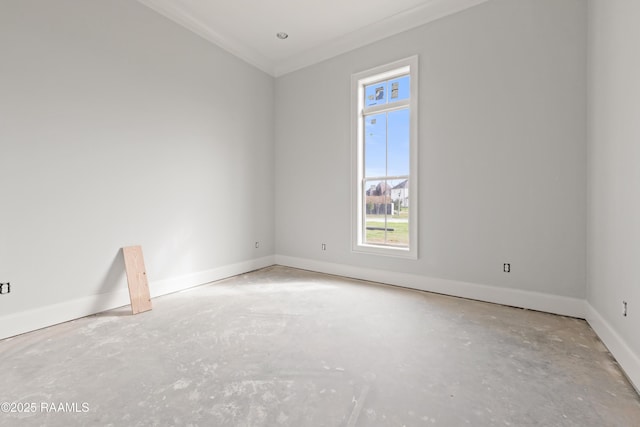 empty room featuring crown molding and concrete floors