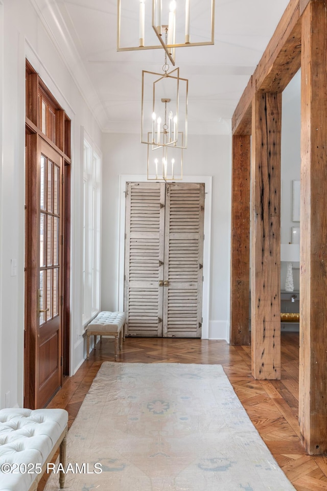 209 Vineyard Row, Lafayette, LA 70508 - foyer with a chandelier, wood finished floors, and ornamental molding