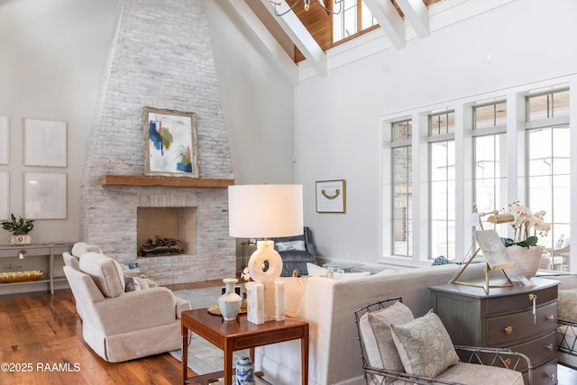 209 Vineyard Row, Lafayette, LA 70508 - living room with high vaulted ceiling, wood finished floors, beam ceiling, and a fireplace