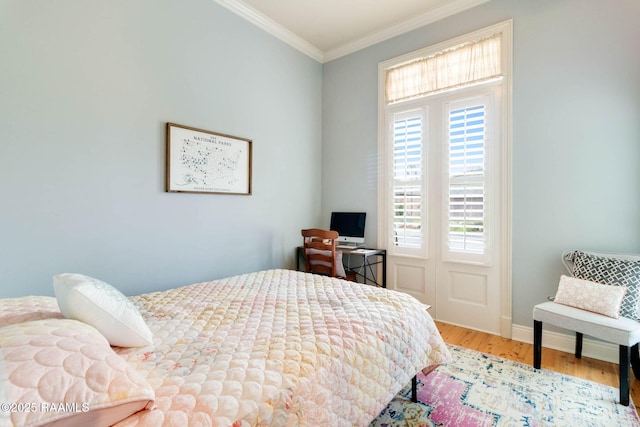 bedroom featuring wood-type flooring and ornamental molding