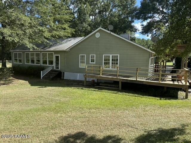 6757 Line Rd, Ethel, LA 70730 - rear view of house featuring a wooden deck, a yard, and a sunroom