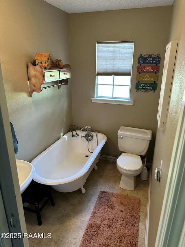 6757 Line Rd, Ethel, LA 70730 - bathroom featuring a freestanding tub and tile patterned floors