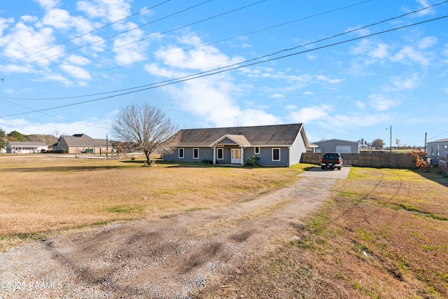 ranch-style house with a front lawn