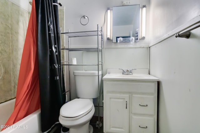 full bathroom featuring vanity, toilet, and shower / tub combo with curtain