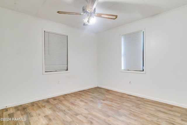 unfurnished room featuring ceiling fan and light hardwood / wood-style floors