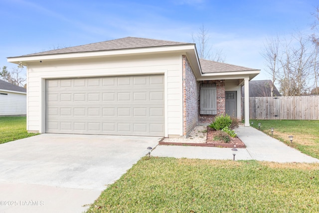 ranch-style house featuring a garage and a front lawn