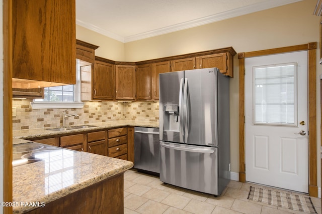 kitchen featuring appliances with stainless steel finishes, backsplash, light stone countertops, crown molding, and sink