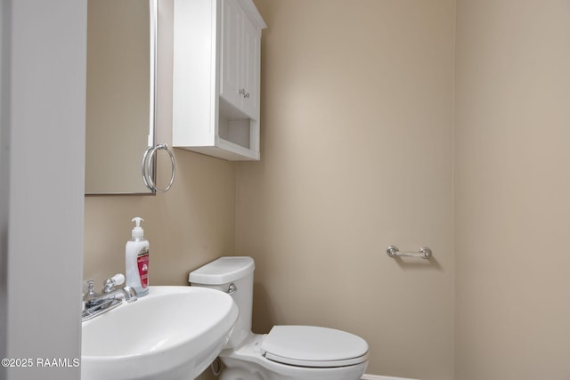 bathroom with sink and toilet