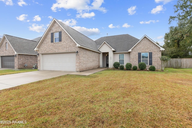 view of front of house featuring a front yard and a garage