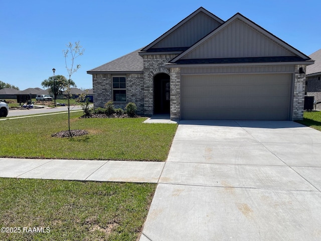 view of front facade featuring a front yard, brick siding, a garage, and concrete driveway