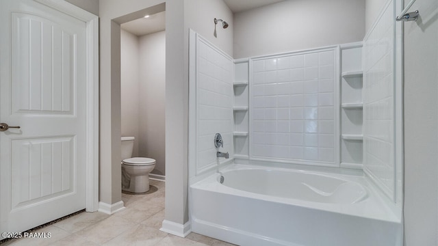 full bathroom with toilet, baseboards, tile patterned flooring, and shower / washtub combination