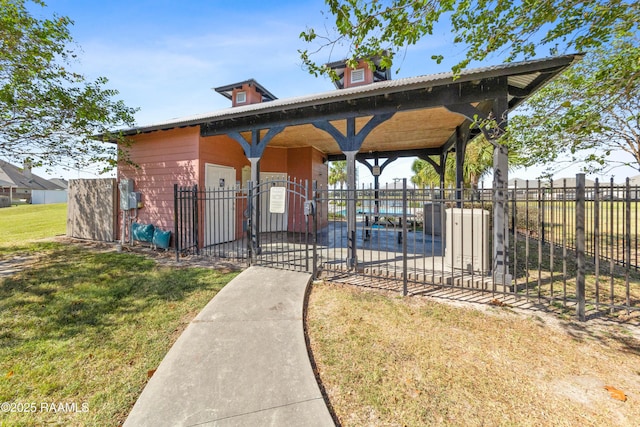 view of property's community with a yard