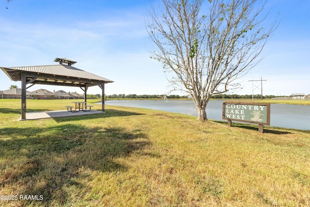 view of yard with a gazebo and a water view