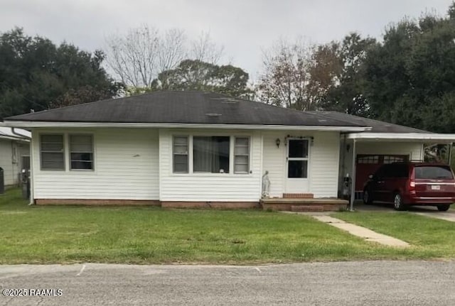 ranch-style home with a front lawn and a carport