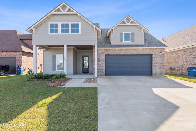 view of front of house featuring a front yard and a garage