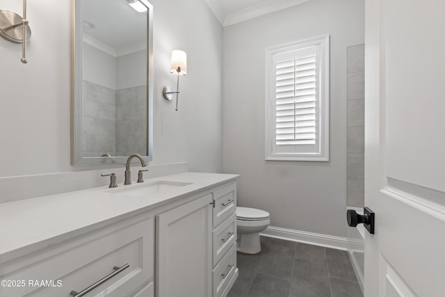 bathroom featuring ornamental molding, tile patterned floors, toilet, and vanity