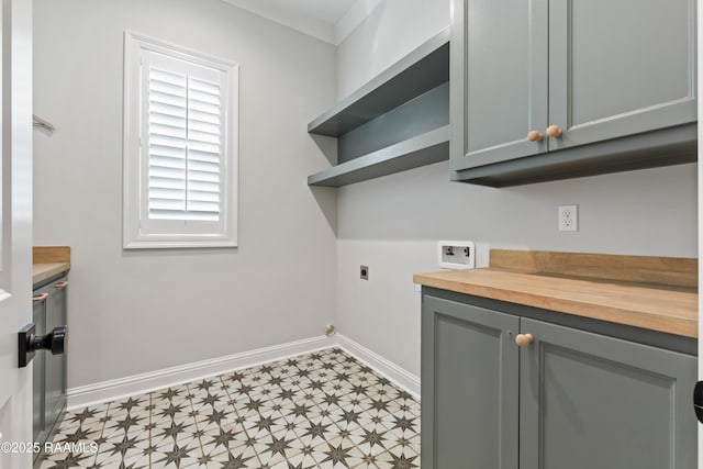 washroom featuring washer hookup, cabinets, and hookup for an electric dryer