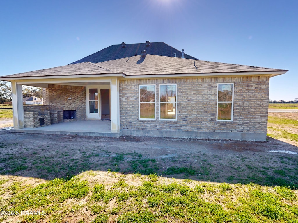 rear view of house with a patio