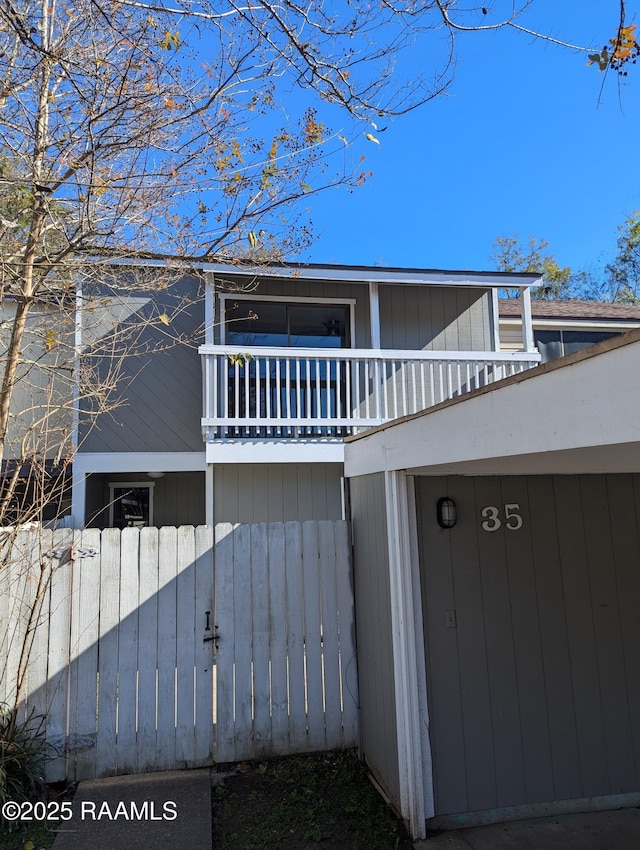 view of side of home with a balcony