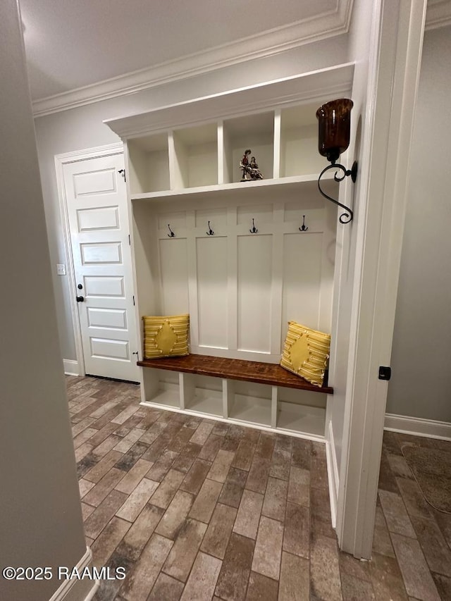 mudroom featuring ornamental molding