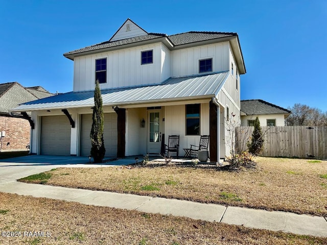 view of front of home with a garage and a porch