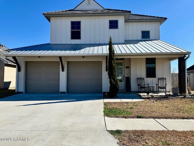 view of front facade with a porch and a garage