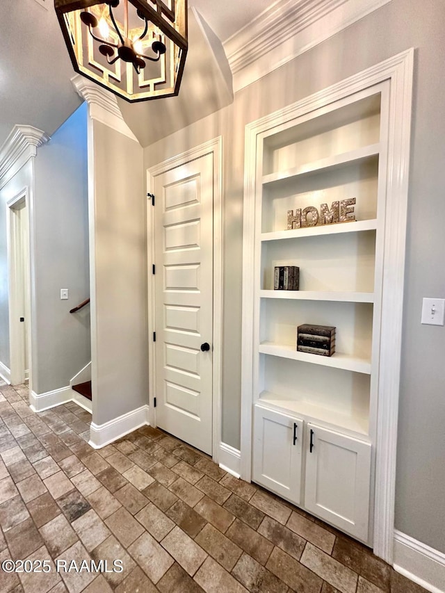 entrance foyer featuring ornamental molding