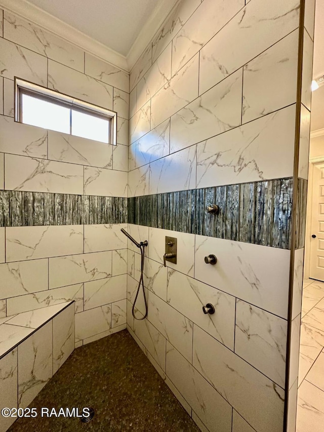 interior space with crown molding and tiled shower