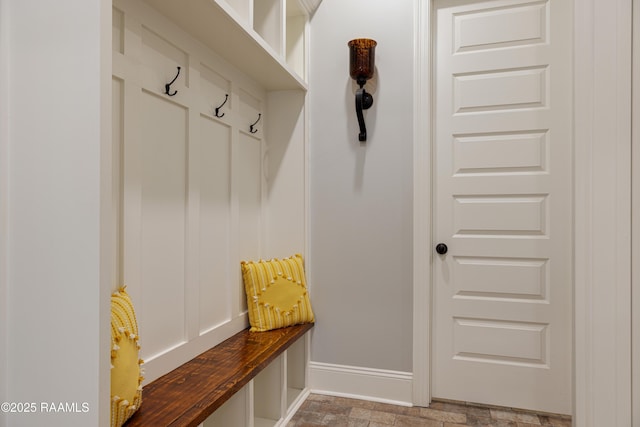 105 Ember Grove Xing, Lafayette, LA 70508 - mudroom featuring baseboards and stone finish flooring